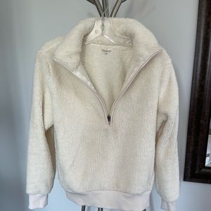 White teddy sweater with half zipper.